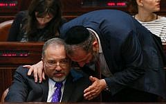 Aryeh Deri with Avigdor Liberman during a plenum session in the Knesset, July 29, 2013. (photo credit: Miriam Alster/Flash90)