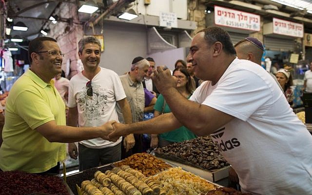 Moshe Lion (L) visits the Mahane Yehuda market in central Jerusalem, August 5, 2013. (photo credit: Yonatan Sindel/Flash90)