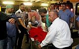 Noam Glick being brought to Shaare Zedek Medical Center in Jerusalem on October 5. (photo credit: Flash90)