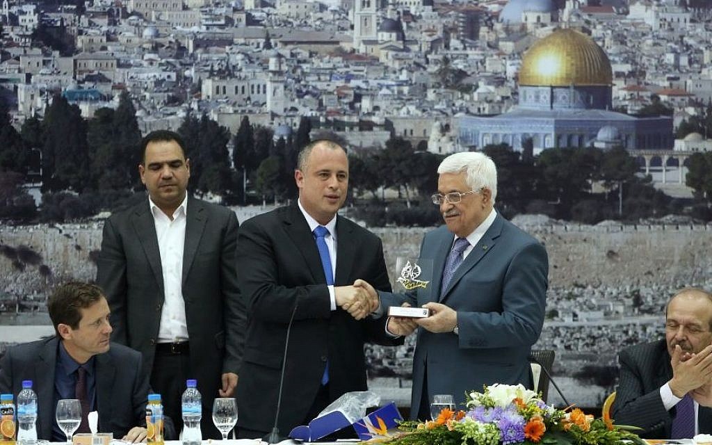 Labor MK Hilik Bar (center) with Palestinian Authority President Mahmoud Abbas during a meeting between Palestinian politicians and Israeli MKs in Ramallah, October 07, 2013. Isaac Herzog, elected Labor leader in November 2013, is seated at left. (photo credit: Flash90) Labor MK Hilik Bar (center) with Palestinian Authority President Mahmoud Abbas during a meeting between Palestinian politicians and Israeli MKs in Ramallah, October 07, 2013. Isaac Herzog, elected Labor leader in November 2013, is seated at left. (photo credit: Flash90)
