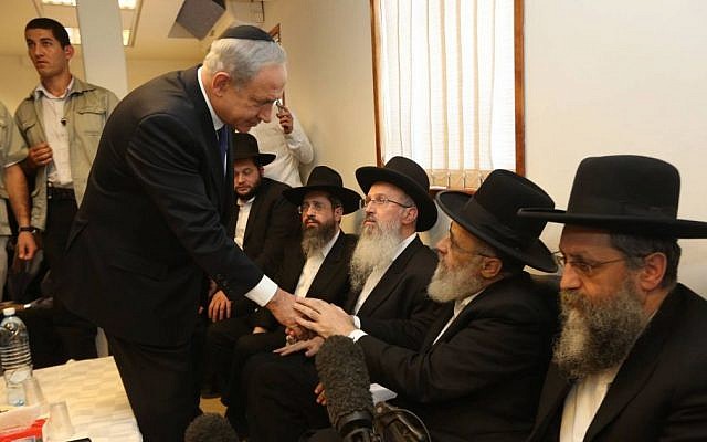 Prime Minister Benjamin Netanyahu pays his respects to the family of Shas spiritual leader Rabbi Ovadia Yosef in Jerusalem, October 08, 2013 (photo credit: Gil Yohanan/Flash90) Prime Minister Benjamin Netanyahu pays his respects to the family of Shas spiritual leader Rabbi Ovadia Yosef in Jerusalem, October 08, 2013 (photo credit: Gil Yohanan/Flash90)