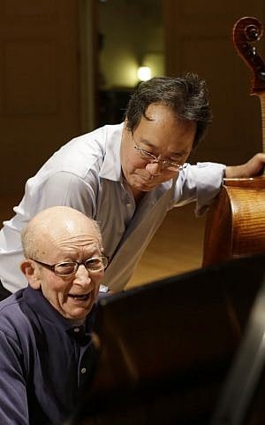 Cellist Yo-Yo Ma, rear, rehearses with Holocaust survivor George Horner on stage at Symphony Hall Tuesday, Oct. 22, 2013, in Boston. (photo credit: AP Photo/Steven Senne)