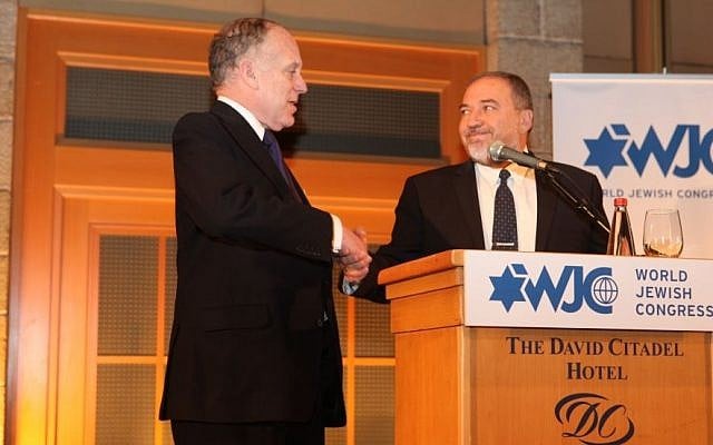 World Jewish Congress President Ronald S. Lauder, left, shakes hands with MK Avigdor Liberman (photo credit: Shimon Arbiv) World Jewish Congress President Ronald S. Lauder, left, shakes hands with MK Avigdor Liberman (photo credit: Shimon Arbiv)