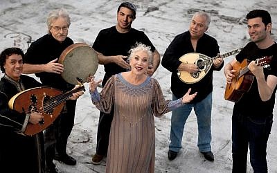 Ljuba Davis presides over an ensemble of diverse musicians performing music in Ladino (photo credit: JTA)
