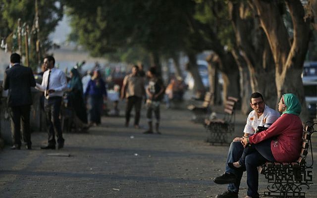 In this Sunday, Sept. 8, 2013 file photo, people enjoy the afternoon by the Nile river in Cairo. (photo credit: AP Photo/Lefteris Pitarakis) 