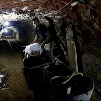 A Palestinian in a smuggling tunnel connecting Gaza and Egypt (photo credit: Hatem Moussa/AP) A Palestinian in a smuggling tunnel connecting Gaza and Egypt (photo credit: Hatem Moussa/AP)
