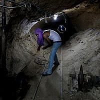 Working in a Palestinian smuggling tunnel connecting Gaza and Egypt in 2013. (photo credit: Hatem Moussa/AP)