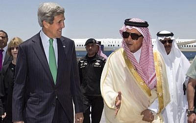 US Secretary of State John Kerry, left, is greeted by Saudi Foreign Minister Prince Saud al-Faisal upon arrival in Jeddah, Saudi Arabia, in June (photo credit: AP/Jacquelyn Martin)
