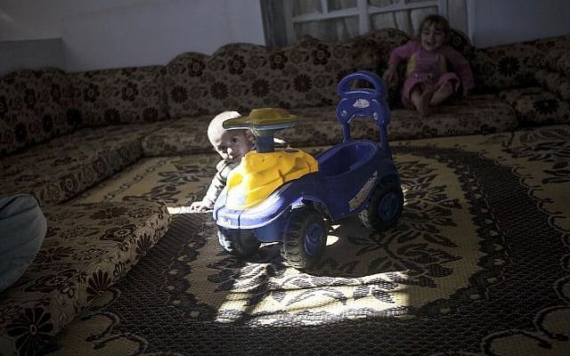 A young child from the Kale family plays at his family house in Kfar Lata. (photo credit: AP Photo) A young child from the Kale family plays at his family house in Kfar Lata. (photo credit: AP Photo)