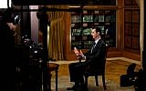 President Bashar Assad gestures as he speaks during an interview with Lebanon’s Al-Mayadeen TV, at the presidential palace in Damascus, Syria, Monday, Oct. 21, 2013 (photo credit: AP/SANA)