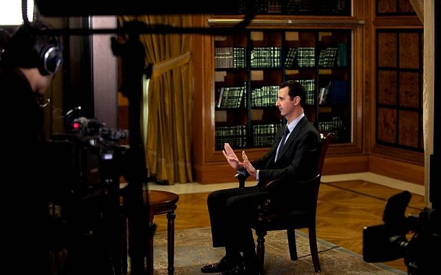 President Bashar Assad gestures as he speaks during an interview with Lebanon’s Al-Mayadeen TV, at the presidential palace in Damascus, Syria, Monday, Oct. 21, 2013 (photo credit: AP/SANA) President Bashar Assad gestures as he speaks during an interview with Lebanon’s Al-Mayadeen TV, at the presidential palace in Damascus, Syria, Monday, Oct. 21, 2013 (photo credit: AP/SANA)