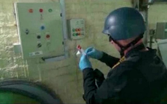 Video broadcast on Syrian State Television purports to show an UN expert examining a chemical weapons plant at an unknown location in Syria, October 8, 2013 (AP/Syrian State Television) Video broadcast on Syrian State Television purports to show an UN expert examining a chemical weapons plant at an unknown location in Syria, October 8, 2013 (AP/Syrian State Television)
