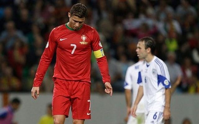 Portugal's Cristiano Ronaldo during a tied World Cup qualifier game against Israel, Friday, Oct 11, 2013 (photo credit: AP) Portugal's Cristiano Ronaldo during a tied World Cup qualifier game against Israel, Friday, Oct 11, 2013 (photo credit: AP)