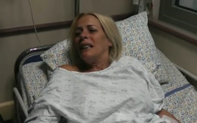 Monique Mor, whose husband was killed in a suspected terror attack, speaks to reporters from her hospital bed, October 11, 2013 (photo credit: Walla news screenshot) Monique Mor, whose husband was killed in a suspected terror attack, speaks to reporters from her hospital bed, October 11, 2013 (photo credit: Walla news screenshot)