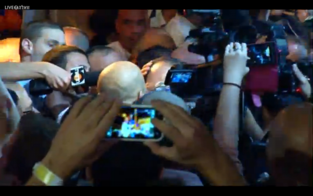 Nir Barkat is swamped by supporters as he arrives to claim victory in the Jerusalem mayoral race, early on October 23, 2013 (photo credit: Walla screenshot) Nir Barkat is swamped by supporters as he arrives to claim victory in the Jerusalem mayoral race, early on October 23, 2013 (photo credit: Walla screenshot)