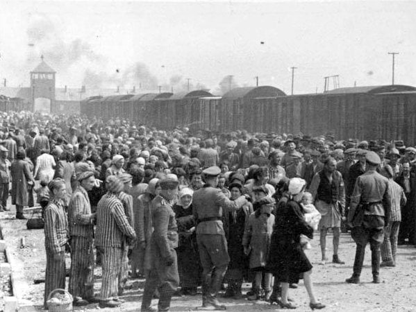 Hungarian Jews on the Judenrampe (Jewish ramp) after disembarking from the transport trains at Auschwitz-Birkenau, May 1944. To be sent rechts! – to the right – meant the person had been chosen as a laborer; links! – to the left – meant death in the gas chambers. (Photo credit: From the Auschwitz Album) Hungarian Jews on the Judenrampe (Jewish ramp) after disembarking from the transport trains at Auschwitz-Birkenau, May 1944. To be sent rechts! – to the right – meant the person had been chosen as a laborer; links! – to the left – meant death in the gas chambers. (Photo credit: From the Auschwitz Album)