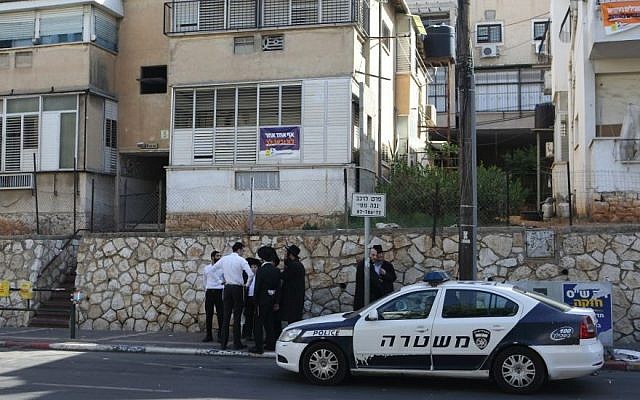 A police car parked outside the house of Rabbi Aharon  Leib Shteinman in the city of Bnei Brak near Tel Aviv on October 23, 2013, after he was attacked early Wednesday morning by a haredi man who broke into his home. The rabbi was only very lightly injured in the incident. (photo credit: Flash90)