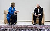 EU High Representative for Foreign Affairs Catherine Ashton, left, talks to Iranian Foreign Minister Mohammad Javad Zarif, right, during a photo opportunity prior to the start of two days of closed-door nuclear talks on Tuesday, October 15, 2013. (photo credit: AP/Fabrice Coffrini, pool)