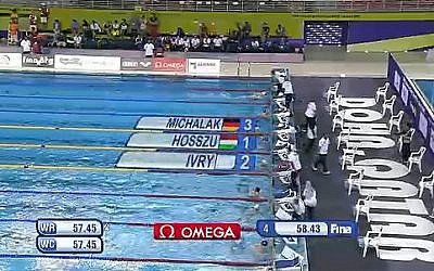 Screenshot of Qatar's footage at the end of the 100-meter individual medley, in which Israel's Amit Ivri won the silver medal. Instead of the Israeli flag, a white flag is displayed. (photo credit: YouTube Screengrab)