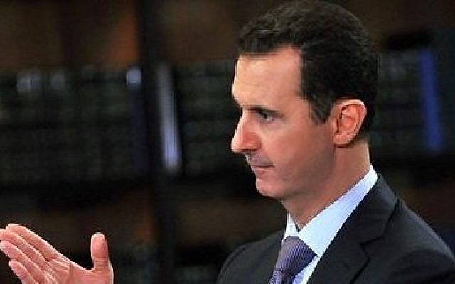 Syrian President Bashar Assad gestures during an interview with Italy's RAI News 24 TV, at the presidential palace in Damascus, Syria, Sept. 29, 2013 (photo credit: AP/SANA) Syrian President Bashar Assad gestures during an interview with Italy's RAI News 24 TV, at the presidential palace in Damascus, Syria, Sept. 29, 2013 (photo credit: AP/SANA)