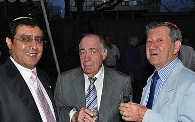 Albert Attias, left, Charles Zslapak, right, and an unidentified man celebrate the centennial of Nairobi Hebrew Congregation on September 9, 2012. (photo credit: JTA/Nairobi Hebrew Congregation)