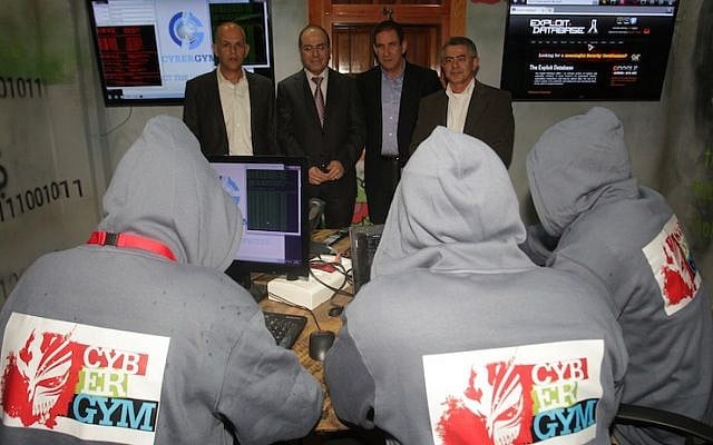 (R. to L.) Chairman of the IEC’s Directorate, Ret. Major General Yiftah Ron-Tal, The Minister of National Infrastructures, Energy and Water Resources, Silvan Shalom, Eli Glickman, CEO of the Israel Electric Corporation, and IEC Deputy CEO and Customer Deputy Director-General, Yaakov (Yasha) Hain face the “red team” hackers at the IEC”s Cyber—Gym (Photo credit: Yossi weiss, IEC Spokesman unit) (R. to L.) Chairman of the IEC’s Directorate, Ret. Major General Yiftah Ron-Tal, The Minister of National Infrastructures, Energy and Water Resources, Silvan Shalom, Eli Glickman, CEO of the Israel Electric Corporation, and IEC Deputy CEO and Customer Deputy Director-General, Yaakov (Yasha) Hain face the “red team” hackers at the IEC”s Cyber—Gym (Photo credit: Yossi weiss, IEC Spokesman unit)