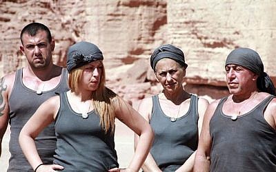The Digmi family, one of the five competing families in reality show 'HaKfar,' with David Digmi, a convicted sex offender, on the left (Courtesy Channel 10)