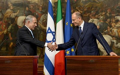Prime Minister Benjamin Netanyahu shakes hands with his Italian counterpart Enrico Letta, following a meeting in Rome, on Tuesday, October 22, 2013. (photo credit: Avi Ohayon/GPO/Flash90)