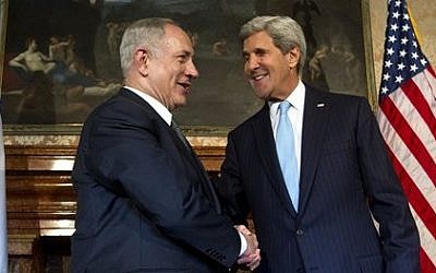 US Secretary of State John Kerry, right, and Israeli Prime Minister Benjamin Netanyahu shake hands for the media on the occasion of their meeting at Villa Taverna, the US Ambassador's residence in Rome, Wednesday, Oct. 23, 2013.  (photo credit: AP Photo/Claudio Peri, Pool)