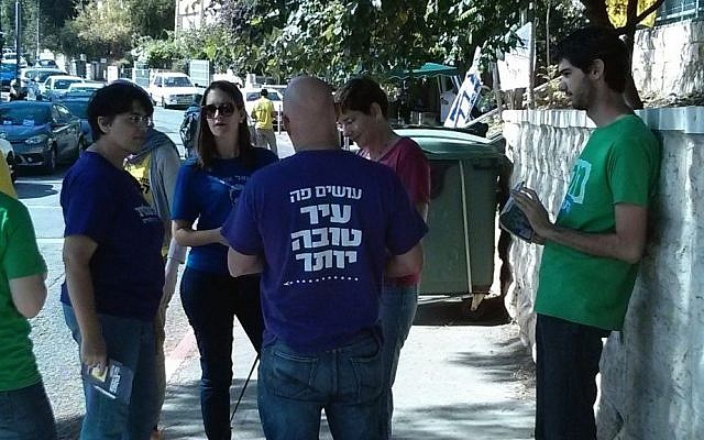 Last-minute canvassers at a Jerusalem polling station (photo credit: Haviv Rettig Gur/Times of Israel)