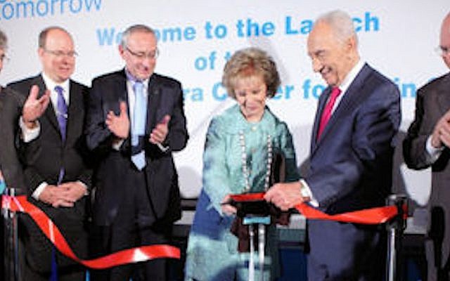 Mrs. Lily Safra cuts the ribbon marking the public launch of the Hebrew University’s Edmond and Lily Safra Center for Brain Science as (from right) University Board of Governors Chairman Michael Federmann, President Shimon Peres, University President Prof. Menahem Ben-Sasson, Prince Albert II of Monaco and ELSC Director Prof. Eilon Vaadia look on (Photo credit: Courtesy) Mrs. Lily Safra cuts the ribbon marking the public launch of the Hebrew University’s Edmond and Lily Safra Center for Brain Science as (from right) University Board of Governors Chairman Michael Federmann, President Shimon Peres, University President Prof. Menahem Ben-Sasson, Prince Albert II of Monaco and ELSC Director Prof. Eilon Vaadia look on (Photo credit: Courtesy)