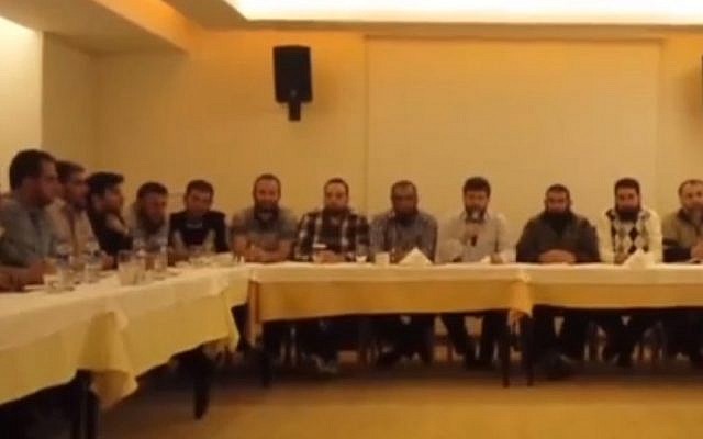 Screenshot from a video released Sunday, October 27, 2013 by 19 Syrian rebel groups stating their rejection of peace talks planned in Geneva for November 23-24. Screenshot from a video released Sunday, October 27, 2013 by 19 Syrian rebel groups stating their rejection of peace talks planned in Geneva for November 23-24.