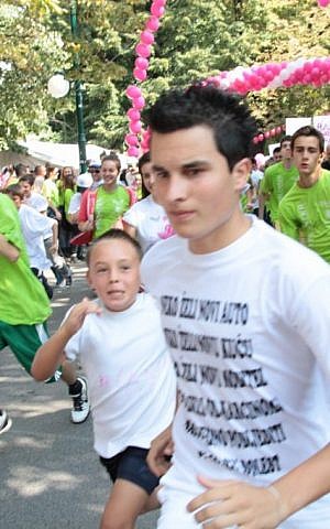 Nermin Music (right) runs in honor of his mother, a breast cancer survivor. (photo credit: Courtesy of JDC)