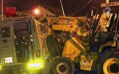 A small tractor shown after it was used in assault attempt at an IDF base, on October 17, 2013 (photo credit: screen capture Channel 2)