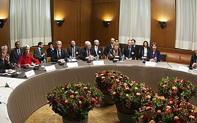 Negotiators from Iran and six world powers meeting in Geneva on November 22, 2013. (photo credit: US State Department)