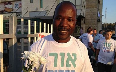 Maurice Sikenyi, a conflict resolution student from Kenya, attends the Tag Meir activity (photo credit: Elhanan Miller/Times of Israel) 