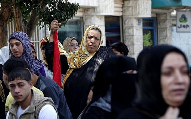 Palestinian supporters of the Democratic Front for the Liberation of Palestine, chant slogans against US Secretary of State John Kerry's visit to Jerusalem and Bethlehem, during a protest in Gaza City, Wednesday, November 6, 2013. (photo credit: AP/Adel Hana) Palestinian supporters of the Democratic Front for the Liberation of Palestine, chant slogans against US Secretary of State John Kerry's visit to Jerusalem and Bethlehem, during a protest in Gaza City, Wednesday, November 6, 2013. (photo credit: AP/Adel Hana)