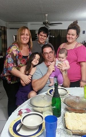 Vered Maoz (left) with her husband Yuval and their children in Kingston. (photo credit: Courtesy of Vered Maoz)