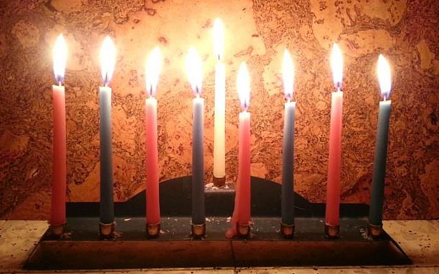 A full menorah with eight candles (By יעל י (Own work) [CC-BY-SA-3.0)