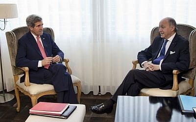 US Secretary of State John Kerry, left, and French Foreign Minister Laurent Fabius sit together during a photo opportunity before a meeting, Saturday, Nov. 23, 2013, in Geneva, Switzerland. (photo credit: AP Photo/Carolyn Kaster, Pool)