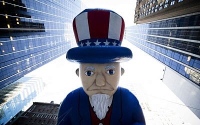 A giant Uncle Sam balloon is marched down 6th Avenue during the 87th Annual Macy's Thanksgiving Day Parade, Thursday, Nov. 28, 2013, in New York (photo credit: AP/John Minchillo) A giant Uncle Sam balloon is marched down 6th Avenue during the 87th Annual Macy's Thanksgiving Day Parade, Thursday, Nov. 28, 2013, in New York (photo credit: AP/John Minchillo)