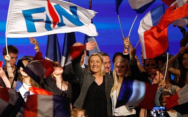 French far-right party leader Marine Le Pen waves to supporters, at the end of the National Front's summer convention in Marseille, southern France, Sunday, Sept. 15, 2013. (photo credit: AP Photo/Claude Paris) French far-right party leader Marine Le Pen waves to supporters, at the end of the National Front's summer convention in Marseille, southern France, Sunday, Sept. 15, 2013. (photo credit: AP Photo/Claude Paris)