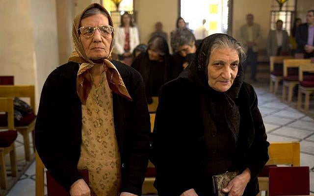 In this photograph taken on Sunday, Oct. 27, 2013, women stand during a service in an Armenian Orthodox church in Damascus, Syria (photo credit: AP/Dusan Vranic) In this photograph taken on Sunday, Oct. 27, 2013, women stand during a service in an Armenian Orthodox church in Damascus, Syria (photo credit: AP/Dusan Vranic)