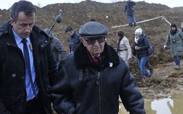 President of the International Criminal Tribunal for the Former Yugoslavia (ICTY) Theodor Meron visits the mass grave Tomasica, near the Bosnian town of Prijedor, 260 km north west of Sarajevo, on Monday, Nov. 25, 2013. (photo credit: AP Photo/Radivoje Pavicic) President of the International Criminal Tribunal for the Former Yugoslavia (ICTY) Theodor Meron visits the mass grave Tomasica, near the Bosnian town of Prijedor, 260 km north west of Sarajevo, on Monday, Nov. 25, 2013. (photo credit: AP Photo/Radivoje Pavicic)