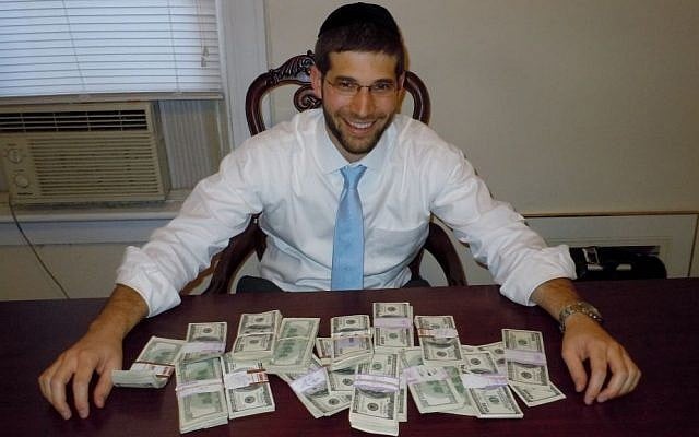 Rabbi Noach Muroff at the desk in which he found $98,000 in cash. (photo credit: Esther Muroff)