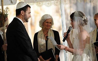 Rabbi Elaine Zecher (center) officiates during a wedding at Boston's Temple Israel (photo credit: courtesy)