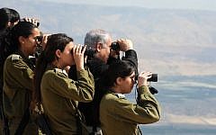 Prime Minister Benjamin Netanyahu observes the Jordan Valley with IDF officers during a tour in 2011. (Moshe Milner/GPO/Flash90)