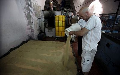 Working through the sesame seeds at the Jebrini tahini factory in the Old City of Jerusalem (photo credit: Yossi Zamir/Flash 90)