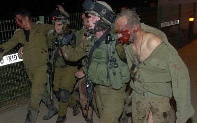 Injured Israeli soldiers are taken into Soroka hospital in Beersheba on October 31, 2013. The IDF said five soldiers when an explosive device went off as troops were clearing a tunnel dug by Hamas from the Gaza Strip into Israel (Photo credit: Dudu Greenspan/Flash90)