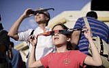 People wear special glasses as they watch a partial solar eclipse at the Givatayim Observatory, Sunday, November 3, 2013 (photo credit: Tomer Neuberg/Flash90)